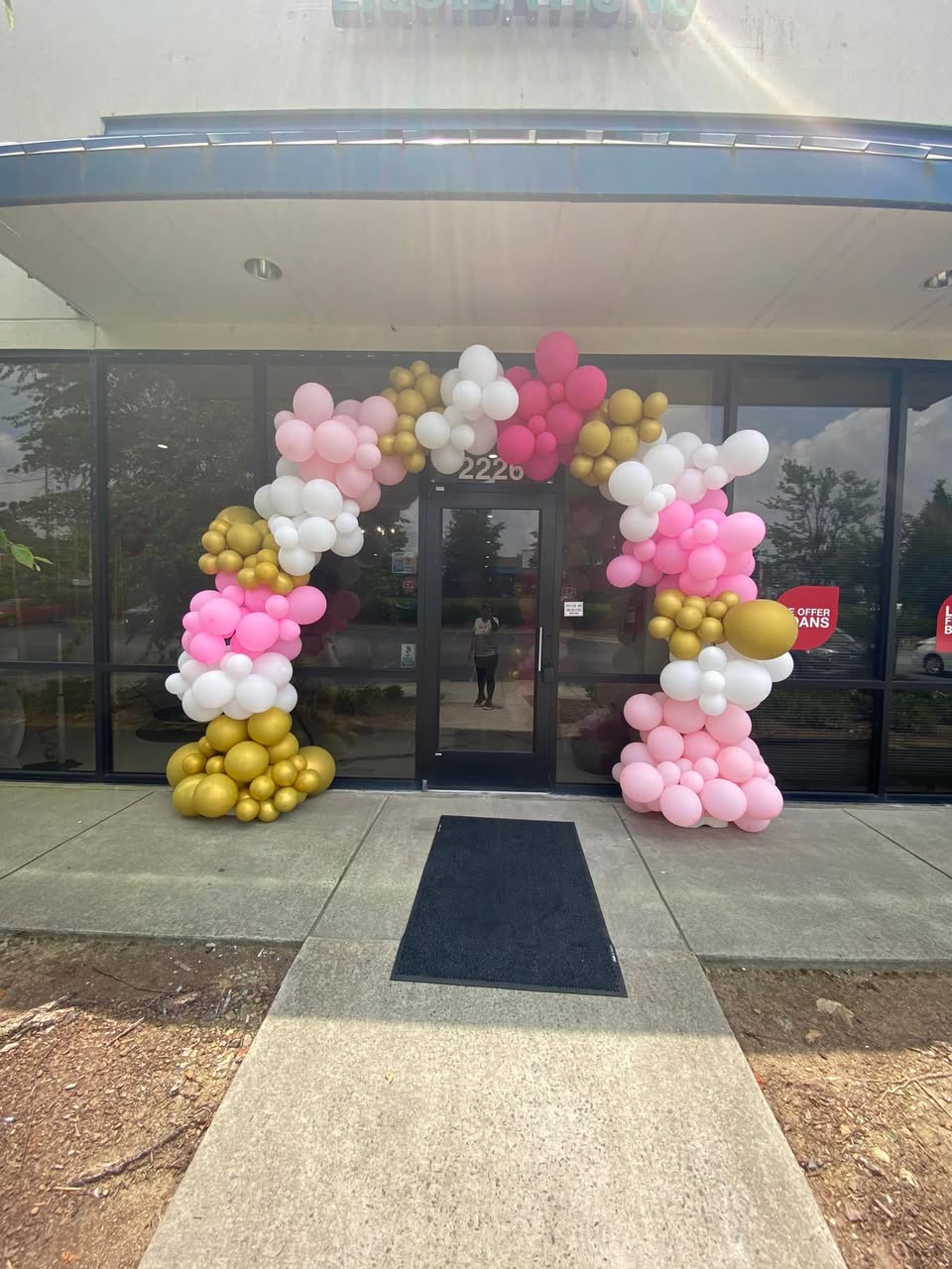 Business Grand Opening - Pink, white and gold organic balloon arch for storefront by Buchannon Events