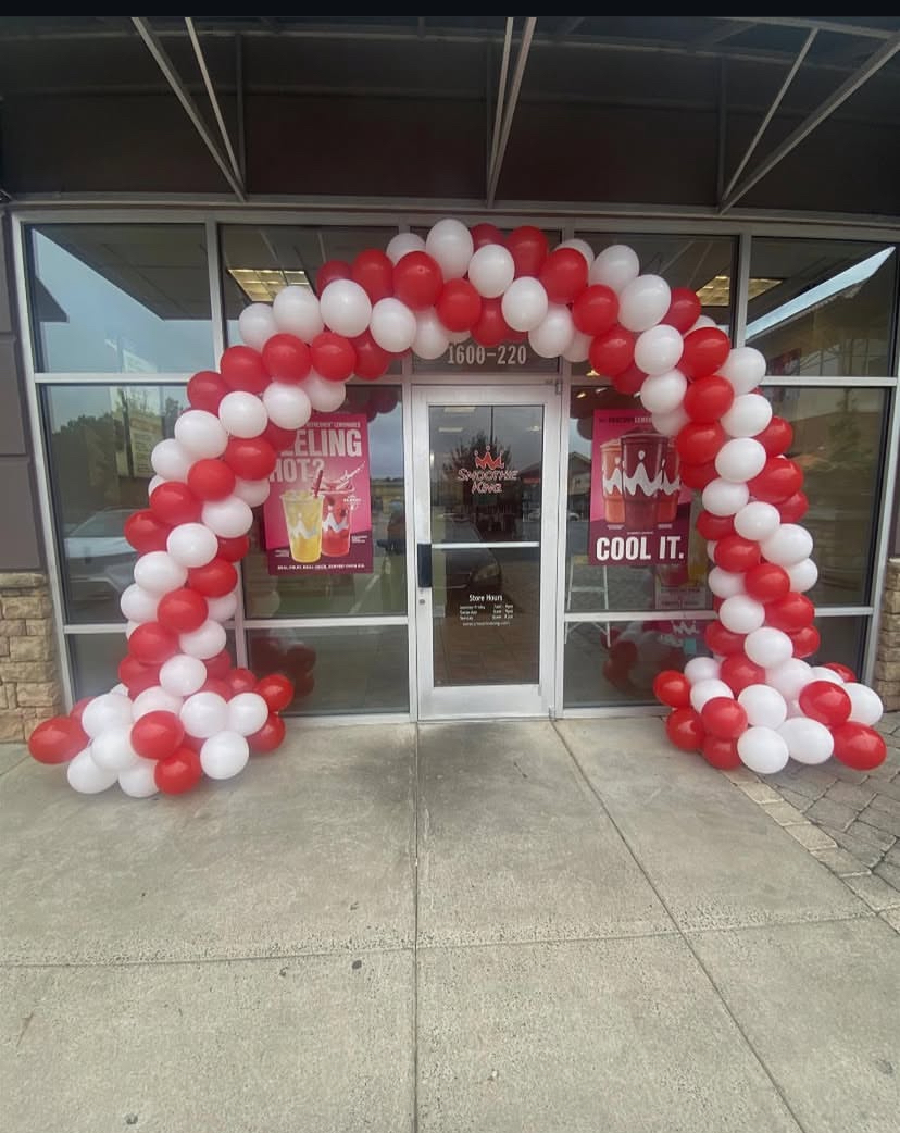 Red and White Balloon Arch - Professional entrance decoration by Buchannon Events